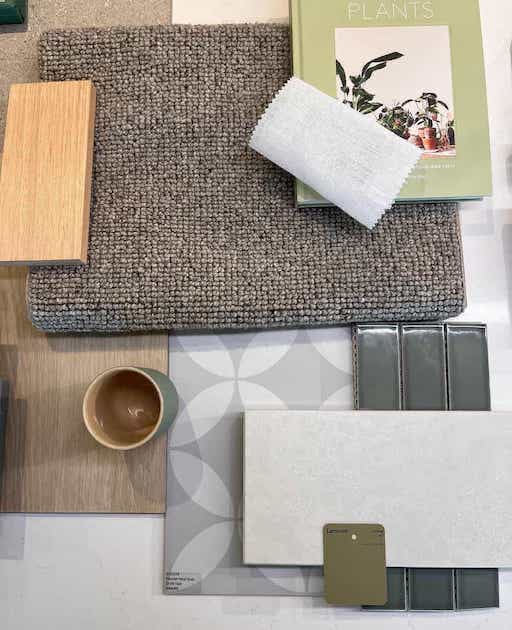 Flatlay with tiles, carpet, mug