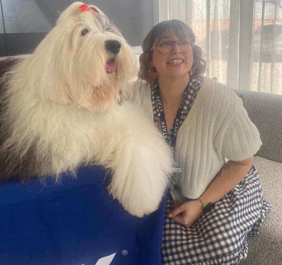 Lucy posing with Dulux dog (the dog is quite large)