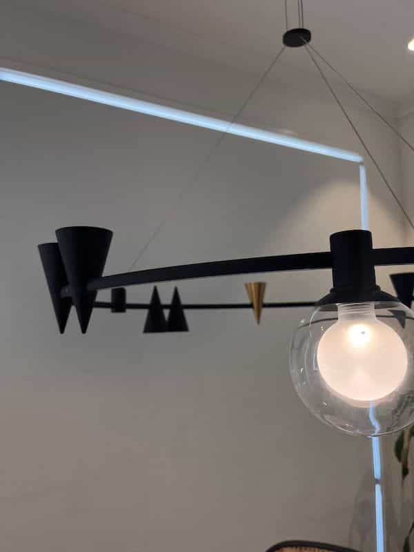 Modern chandelier with cone shapes on it