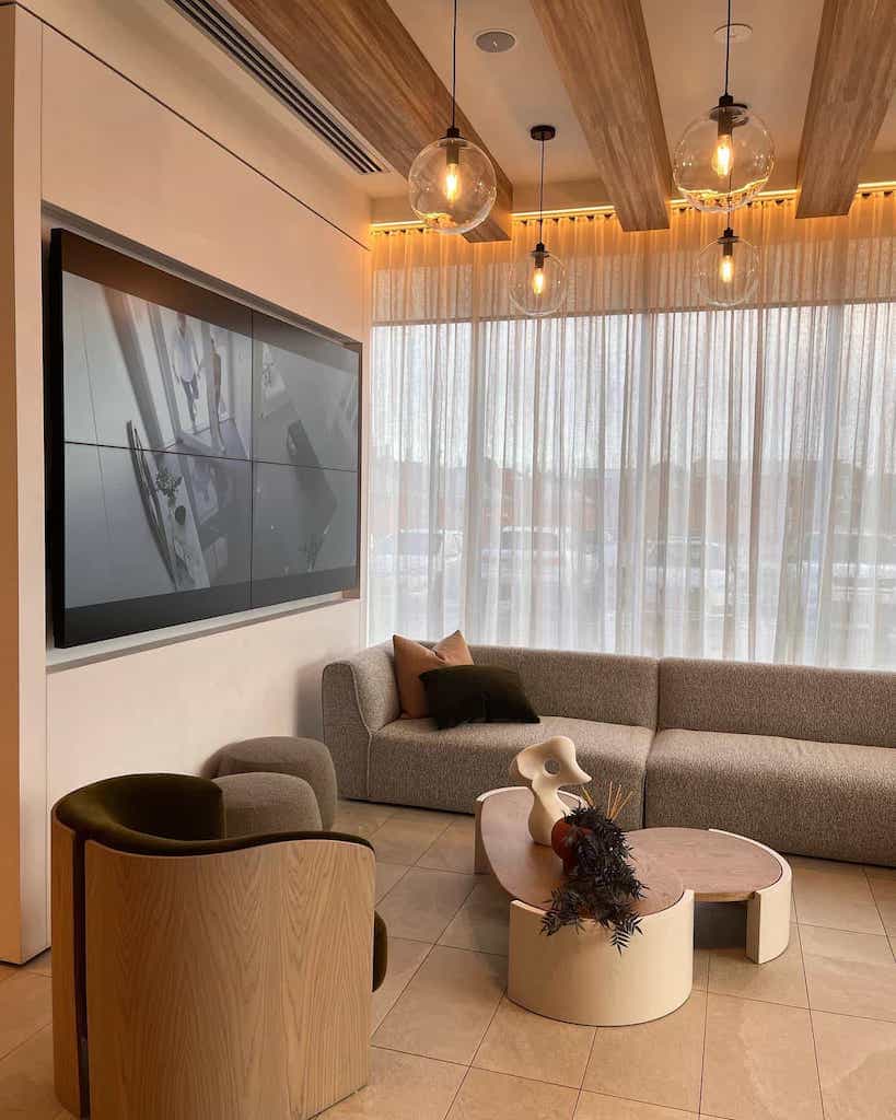 Lobby with modern, round furniture, earthy colours, incandescent bulbs